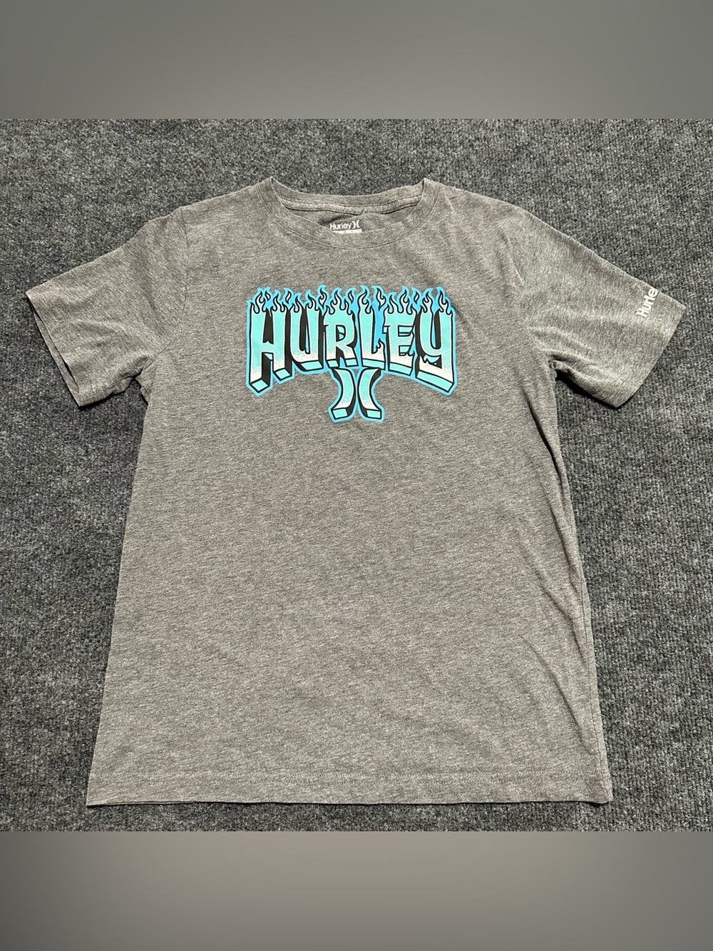 Hurley short-sleeve graphic t-shirt featuring a blue and white flame-style logo
